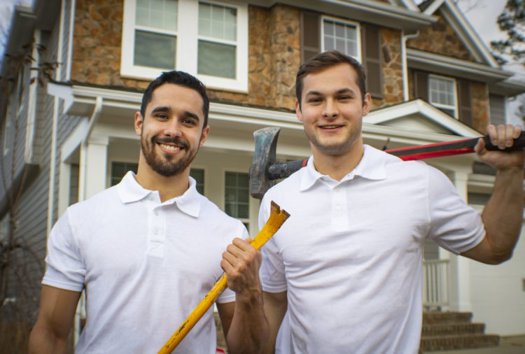 Clutter Boss crew posing before a demolition job in Stark County, OH